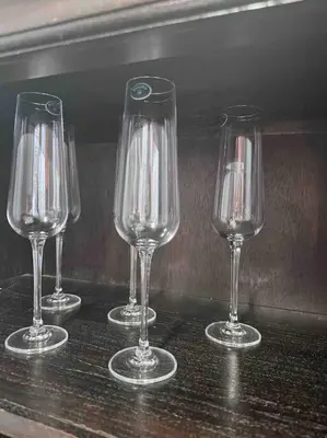 four wine glasses sitting on top of a table at Ft Lauderdale Jewel in Fort Lauderdale
