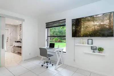 an office with a desk and a computer on a wall at Fox Private Resort-Heated Pool, Spa-Downtown&Beach in Fort Lauderdale