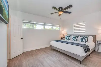 a bedroom with a bed and a ceiling fan at Fox Private Resort-Heated Pool, Spa-Downtown&Beach in Fort Lauderdale