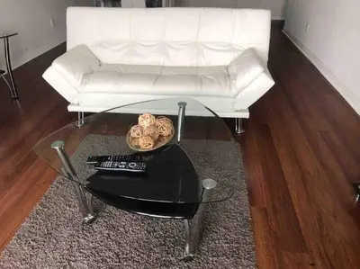 a living room with a white couch and a glass coffee table at Beautiful Apartment in Sunny Isles STR-01432 in Miami Beach