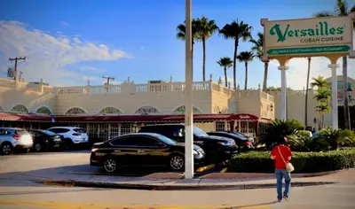 a man walking in front of a car dealership at Private Rooms close to Miami Airport - Free parking - 02 in Miami