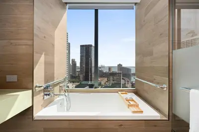 a bathroom with a sink and a large window at EAST Miami Residences in Miami