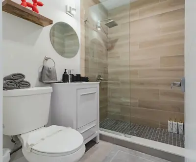 a bathroom with a white toilet and a shower at Mega Fun Villa Northwest Miami BY THE GLAMHOMES in Miami