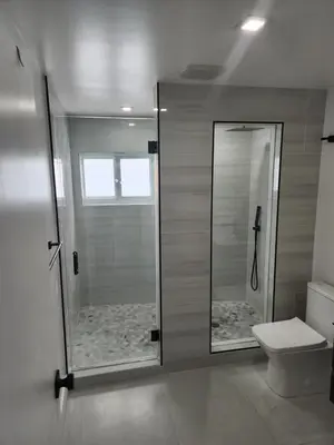 a bathroom with a shower and a toilet at JBMANORS in Fort Lauderdale