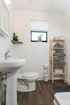 a bathroom with a white toilet and a sink at Lovely Apartment Near Brickell 2 in Miami
