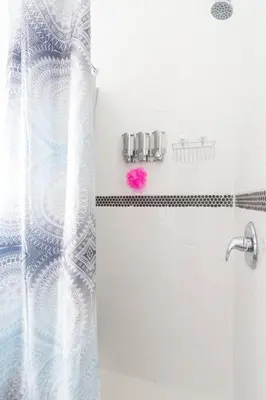 a bathroom with a shower curtain and a pink object at Lovely Apartment Near Brickell 2 in Miami