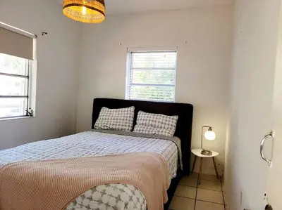 a bedroom with a bed and a window at Tropical Charm Little Havana Calle Ocho 3 in Miami