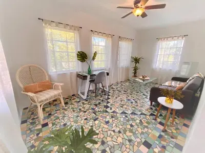 a living room with a colorful tile floor at Tropical Charm Little Havana Calle Ocho 2 in Miami