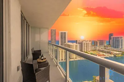 a balcony with a view of a city skyline at Infinite View Balcony Pool Gym in Hallandale Beach