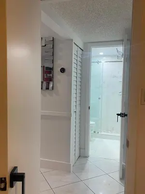 a bathroom with a shower and a glass door at Beautiful House 7 min from Miami Airport w FREE parking in Miami