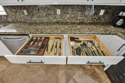 a kitchen counter with a drawer full of utensils at Water Front Home with Boat Dock Hot Tub Roof Top Fire Pit in Fort Lauderdale