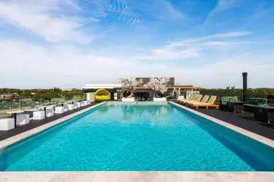 a swimming pool on the roof of a building at Dolce by Wyndham Hollywood in Hollywood