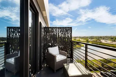 a balcony with a chair and a view at Dolce by Wyndham Hollywood in Hollywood