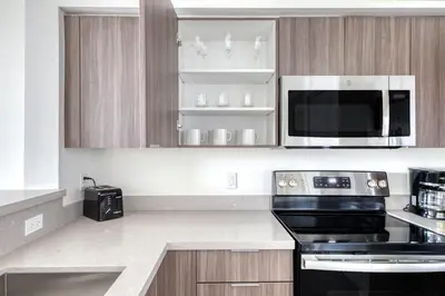 a kitchen with a stove and a microwave at Little Havana 1br w pool gym near restaurants MIA-48 in Miami