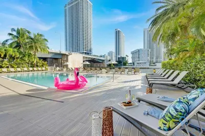 a pool with a pink flamingo in the middle of a city at Infinite View with Balcony and Resort, Pool, Gym in Hallandale Beach