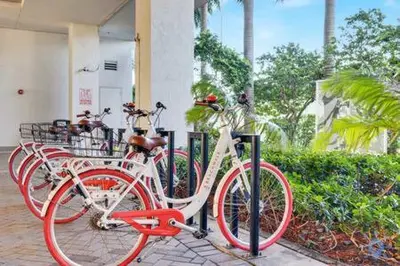 a group of bikes parked in front of a building at Pool - Apartment with Balcony - Gym - Near Beach in Hallandale Beach