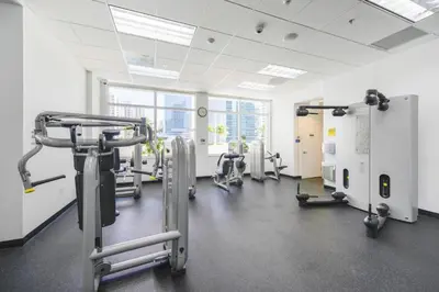a gym with treadmills and machines in a room at Fantastic 2BR Condo on 31st Floor Free Parking in Miami