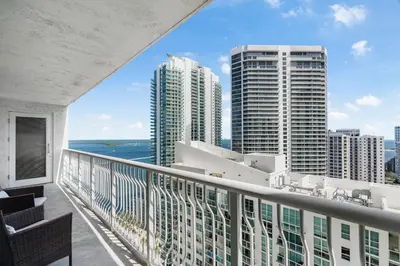 a balcony with a view of the ocean and buildings at Fantastic 2BR Condo on 31st Floor Free Parking in Miami