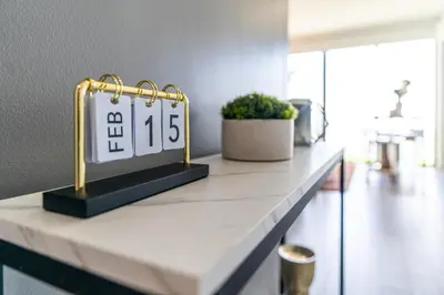 a counter with a clock on top of it at Devereaux Miami Luxury One-Bedroom and Studios in Miami