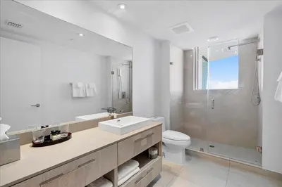 a bathroom with a sink and a toilet and a shower at Ocean Views Perfect Location Resort Amenities in Hallandale Beach