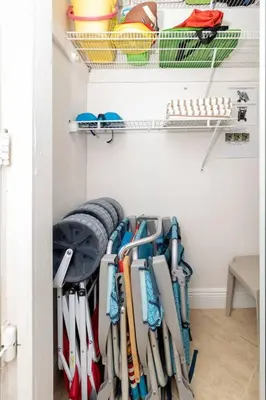 a walk in closet with a bunch at Modern Oceanview Condo - Steps to the Beach! in Miami Beach