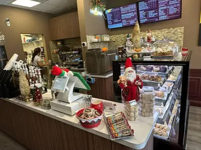 a christmas store counter with santa claus in the cash register at Modern Oceanview Condo - Steps to the Beach! in Miami Beach