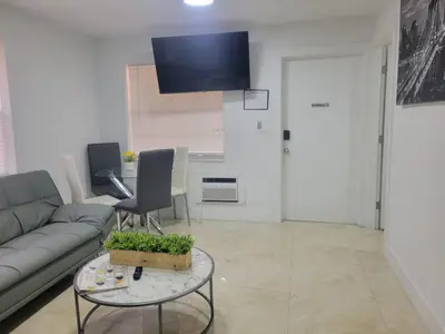 a living room with a couch and a table at 4-PLEX in Fort Lauderdale