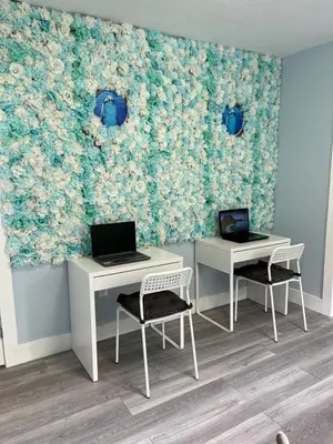 a room with two desks and two laptops on the wall at Blue Little Havana in Miami