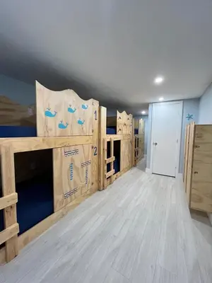 a large room with wooden bunk beds in it at Blue Little Havana in Miami