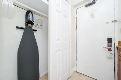 a black tie hanging on a door in a room at Starlite Hotel in Miami Beach