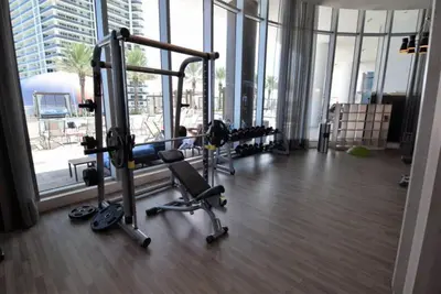 a gym with several exercise equipment in a large building at Lyfe-1005 in Hollywood
