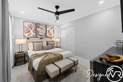 a bedroom with a bed and a ceiling fan at Villa wPool Firepit BBQ in Hollywood