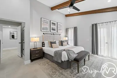 a bedroom with a large bed and two lamps at Villa wPool Firepit BBQ in Hollywood