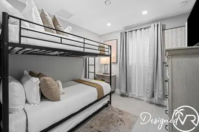 a bedroom with two bunk beds and a window at Villa wPool Firepit BBQ in Hollywood