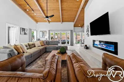 a living room with a couch and a tv at Villa wPool Firepit BBQ in Hollywood