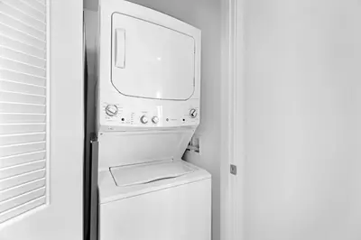 a washer and dryer in a white room at Hyde Beach House - Stunning 2bd 2ba - Apt - Ocean & Intercostal views in Hollywood