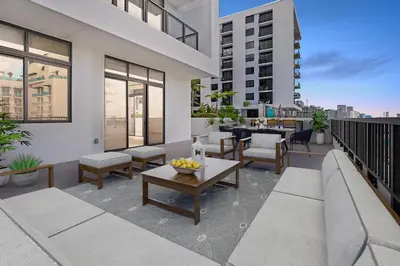 a balcony with a table and chairs on a building at Wynwood 1br w gym pool lounge nr Midtown MIA-35 in Miami