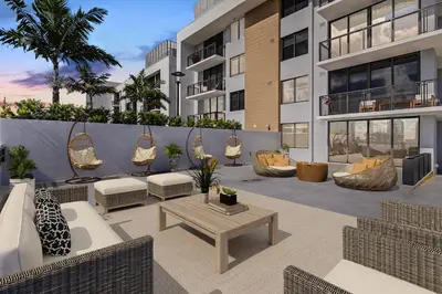 a patio with chairs and a table in a building at Wynwood 1br w gym pool lounge nr Midtown MIA-35 in Miami