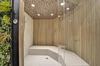 a sauna is shown with a glass wall at Cozy Beachfront 2 BDR & 2 BA Miami Beach Condo in Miami Beach