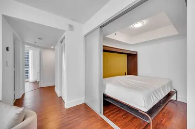 a bedroom with a large bed in the middle of it at Ocean View Amazing Unit Brickell in Miami