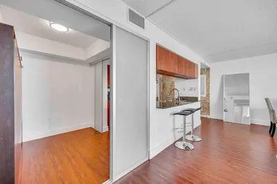 a kitchen with a counter and a stool in a room at Ocean View Amazing Unit Brickell in Miami