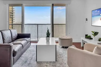 a living room with a couch and a table at Ocean View Amazing Unit Brickell in Miami