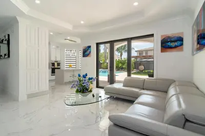 a living room with a couch and a table at The tropical paradise villa in Miami