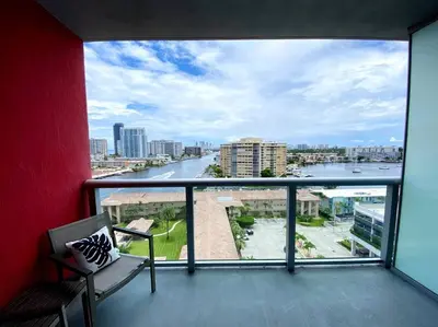a balcony with a view of a river at Beachfront hotel room to relax and unwind 09B in Hallandale Beach