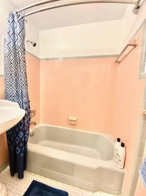 a bathroom with a tub and a sink at Coral Gables / Coconut Grove area FREE parking in Miami