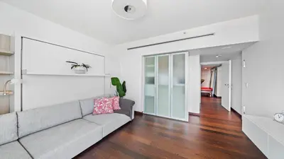 a living room with a couch and a hallway at Oceanfront Private Penthouse Condo at The Setai -3909 in Miami Beach