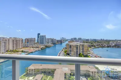 a view of a river from a balcony of a city at Apartment with Balcony, Gym, Pool in Hallandale Beach