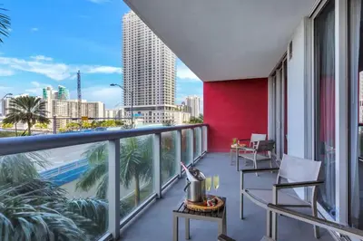 a balcony with a view of the city at Pool Apartment with Balcony, Near Beach in Hallandale Beach