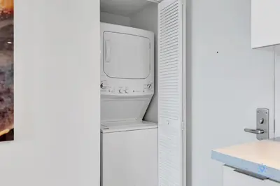 a bathroom with a toilet and a sink at Pool Apartment with Balcony, Near Beach in Hallandale Beach