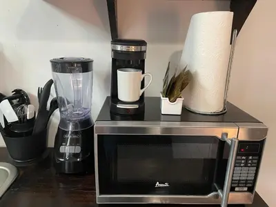 a counter top with a microwave and a blender at Vive Zen 2 Queen Beds in Miami